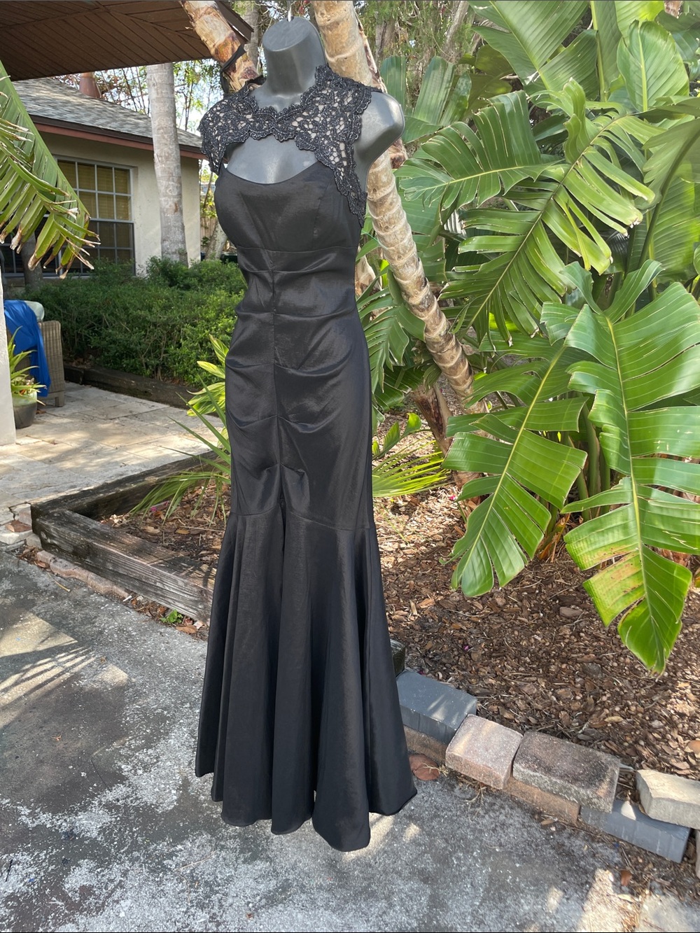 Xscape lace trim rust at a trumpet mermaid gown